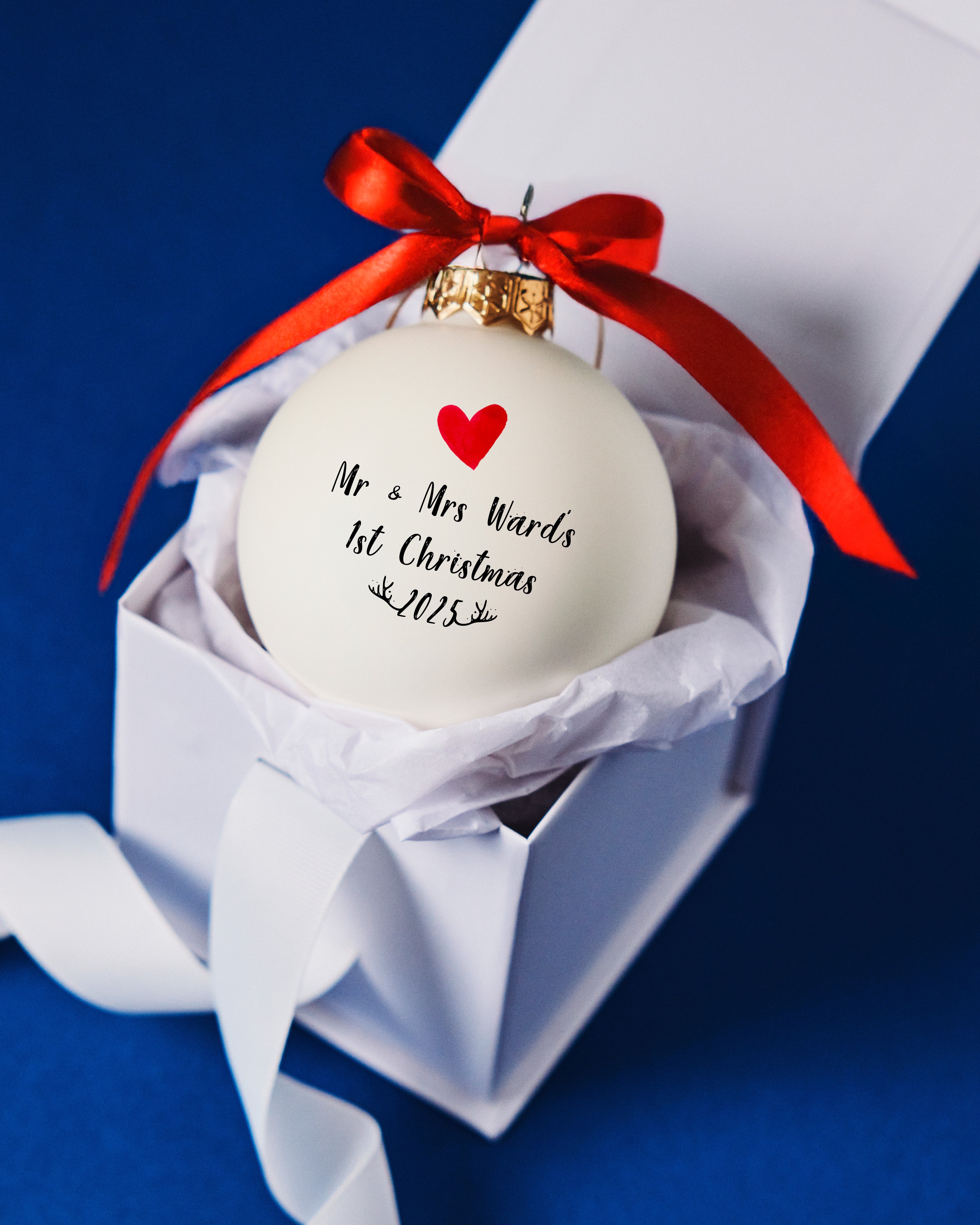 Personalised Mr & Mrs 1st Christmas white glass bauble with red heart and bow, presented in a luxury white gift box – perfect newlywed Christmas keepsake