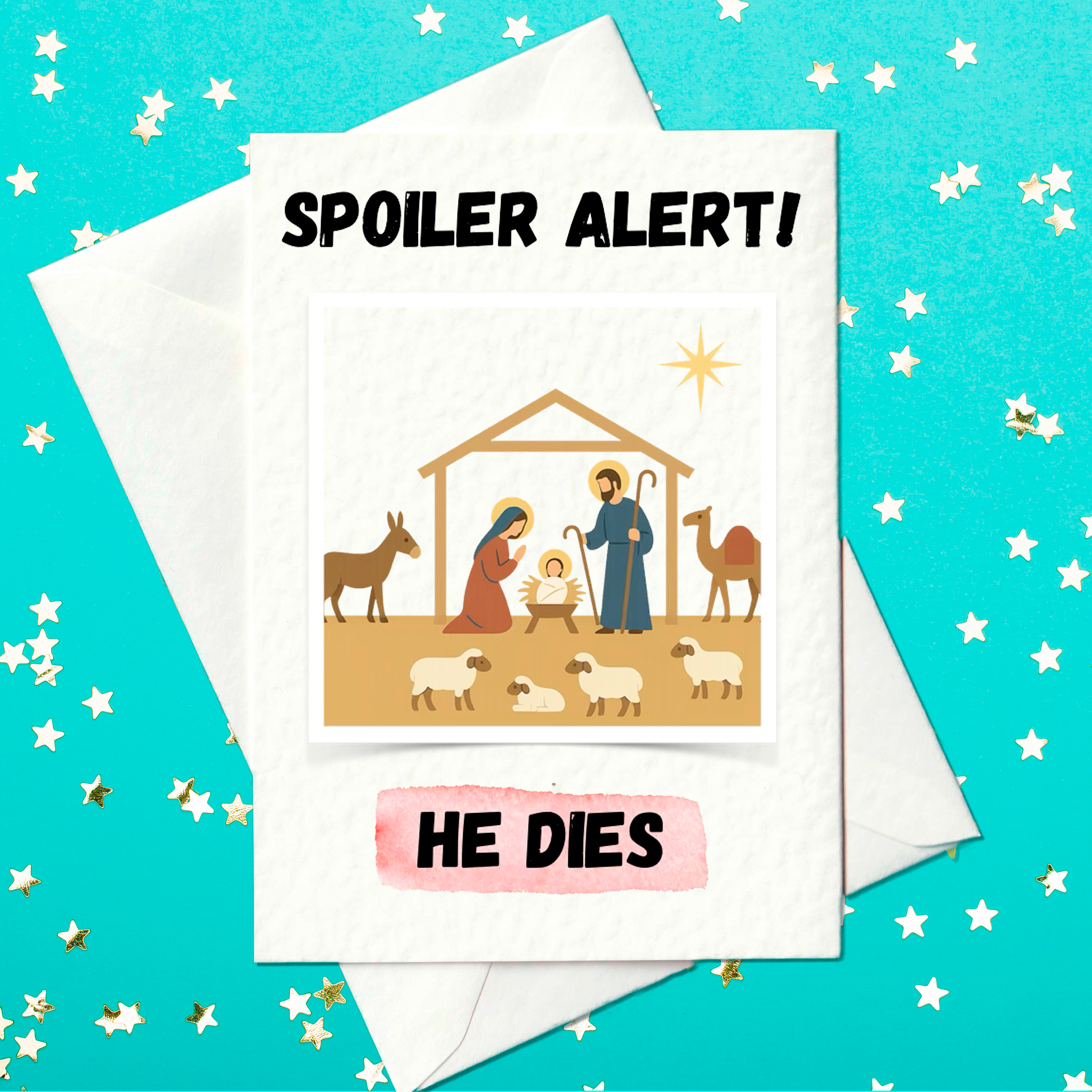 Funny Christmas card showing a nativity scene with Mary, Joseph, baby Jesus, animals and a star, with the text “Spoiler Alert! He Dies” in bold letters.