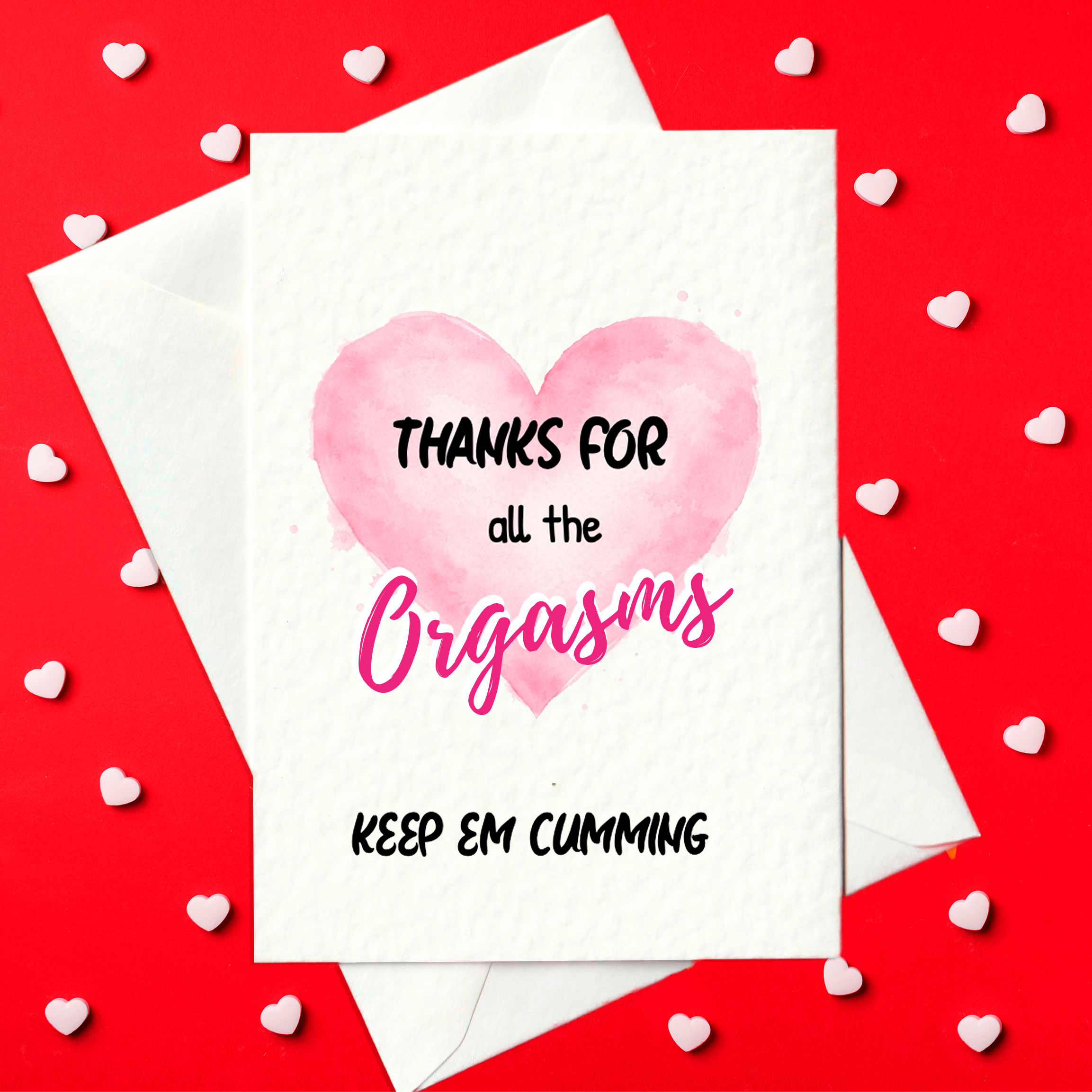 White A6 card with a pink watercolour heart and the text “Thanks for all the orgasms” and “Keep em cumming”; blank inside, envelope shown behind.