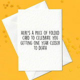 Here's a piece of folded card to celebrate you getting one year closer to death (A6)